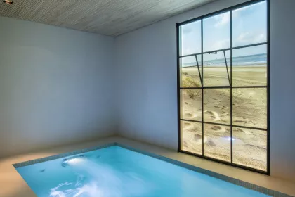 Bigger view of Bouwkundig binnenzwembad met mozaïek afwerking